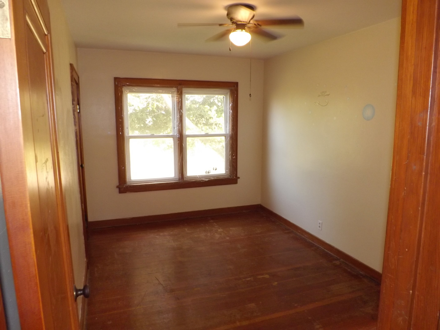 296 Timber Creek Road Dixon, IL 61021 - Photo 12 of 20 an empty room with windows and fan