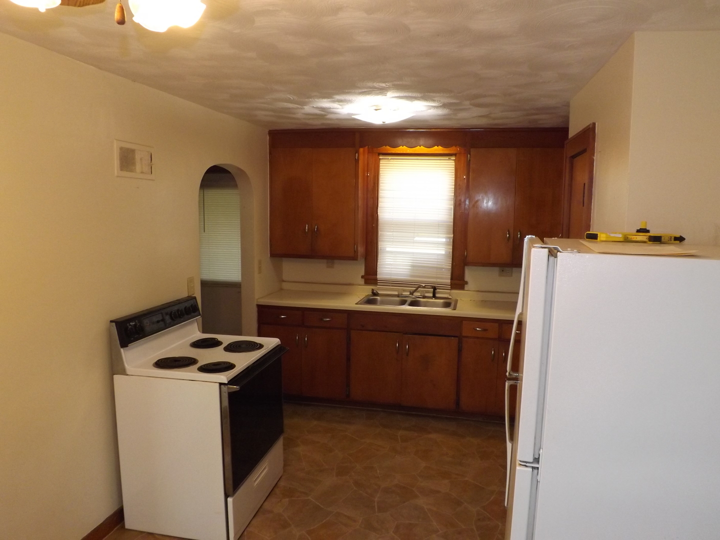 296 Timber Creek Road Dixon, IL 61021 - Photo 13 of 20 a kitchen with a refrigerator and a stove