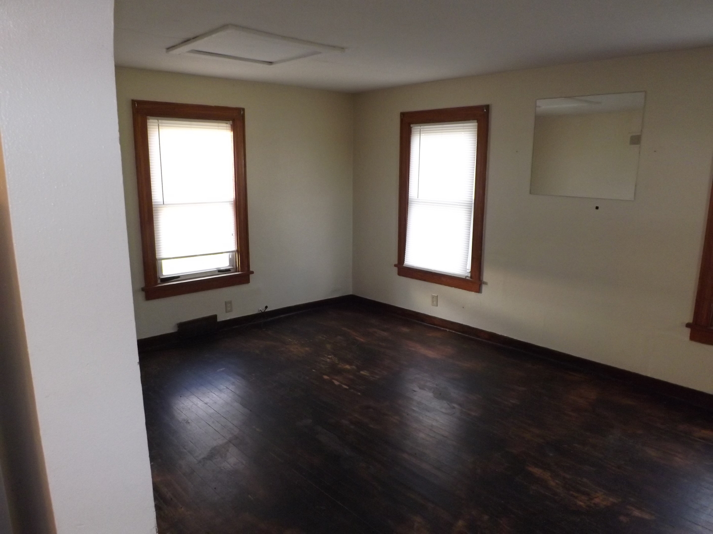 296 Timber Creek Road Dixon, IL 61021 - Photo 15 of 20 an empty room with wooden floor and windows