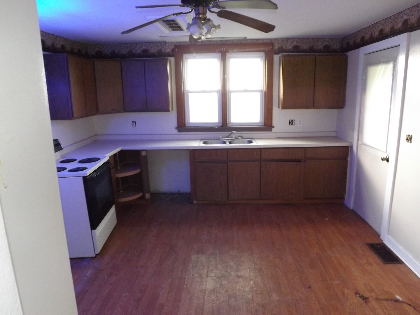 296 Timber Creek Road Dixon, IL 61021 - Photo 5 of 20 a kitchen with sink a window and cabinets