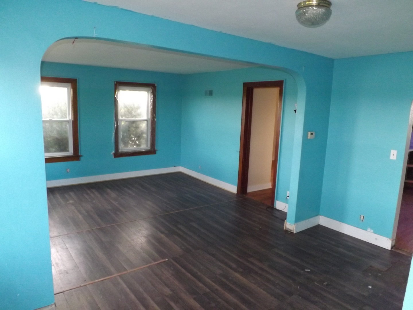 296 Timber Creek Road Dixon, IL 61021 - Photo 6 of 20 a view of empty room with wooden floor and fan