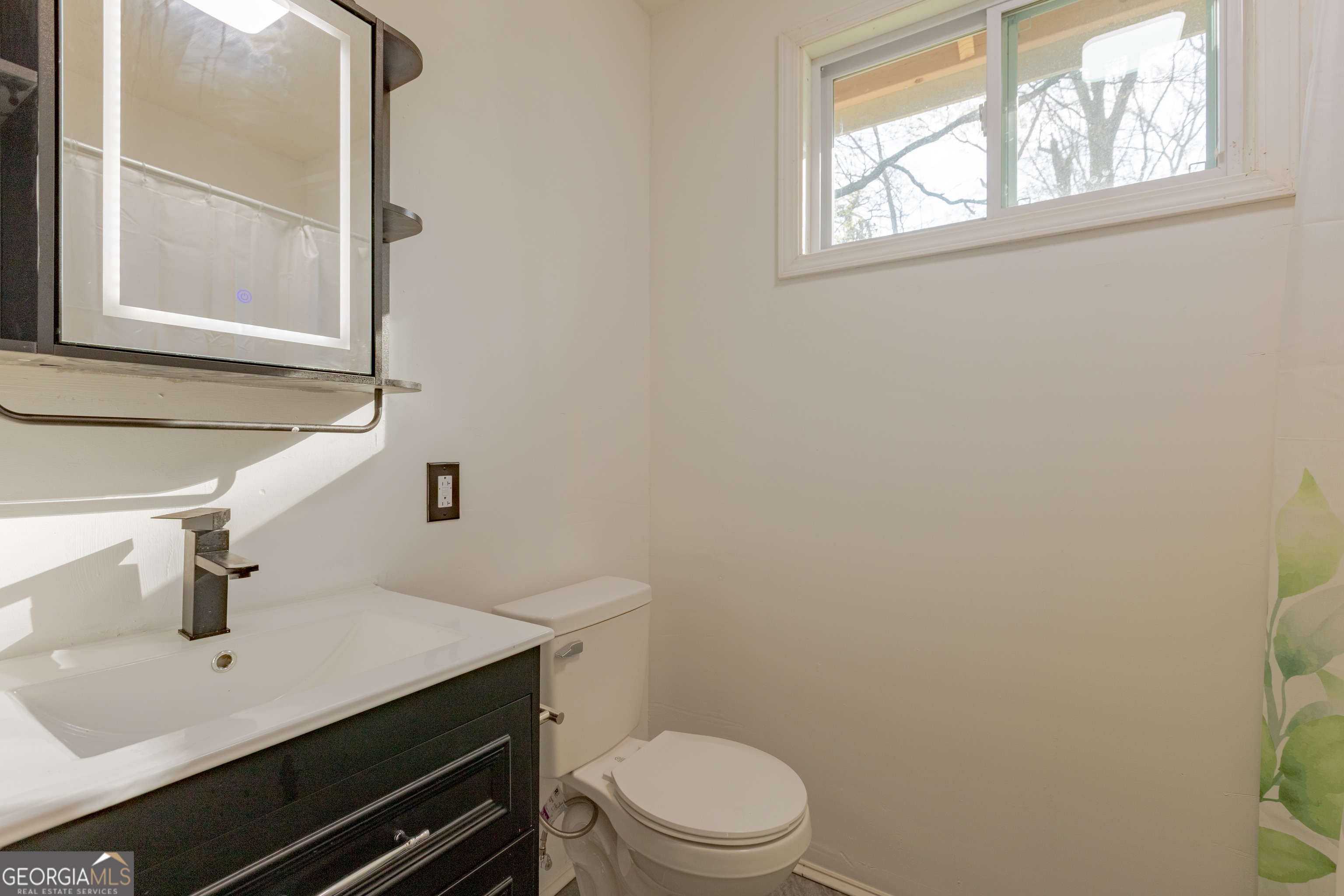 1102 Calvin Avenue Columbus, GA 31903 - Photo 11 of 18 a bathroom with a sink a toilet and window