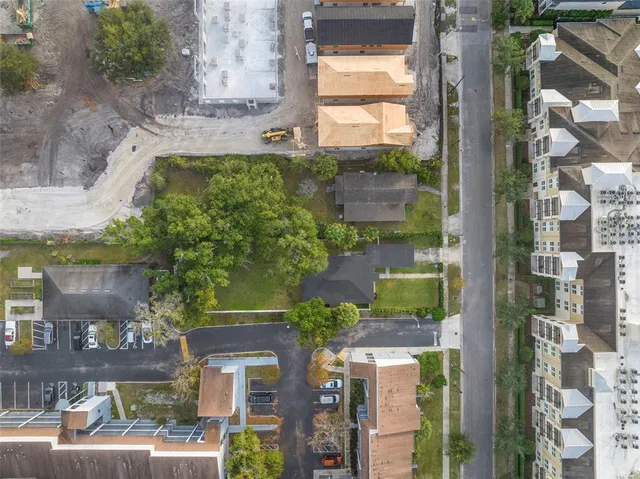 an aerial view of a residential apartment building with a yard