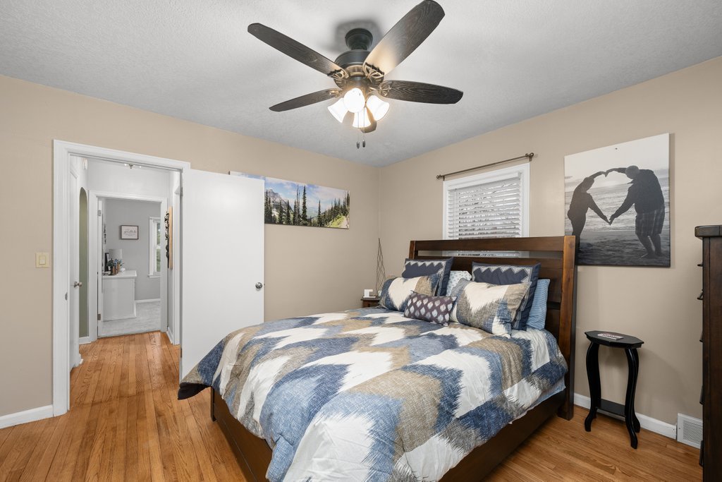 925 12th Avenue Moline, IL 61265 - Photo 16 of 36 a bedroom with a bed and wooden floor