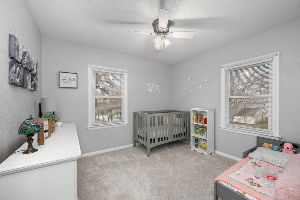 925 12th Avenue Moline, IL 61265 - Photo 17 of 36 a bedroom with furniture and a window