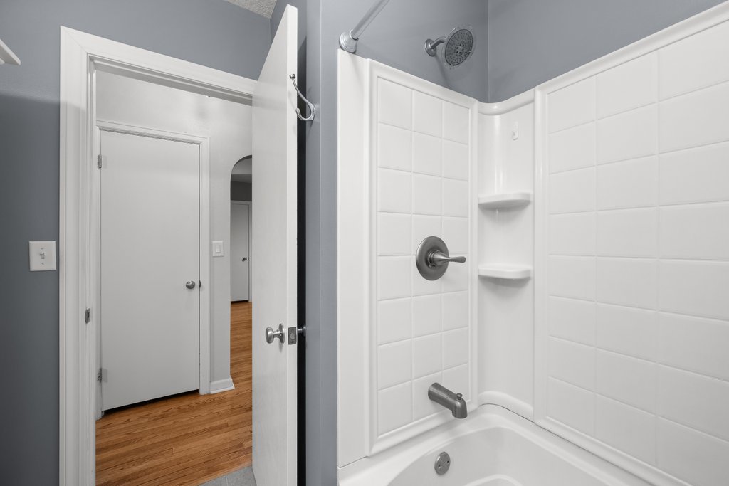 925 12th Avenue Moline, IL 61265 - Photo 20 of 36 a bathroom with a tub and shower