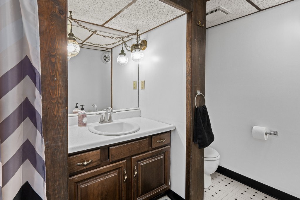925 12th Avenue Moline, IL 61265 - Photo 29 of 36 a bathroom with a sink a vanity and a mirror