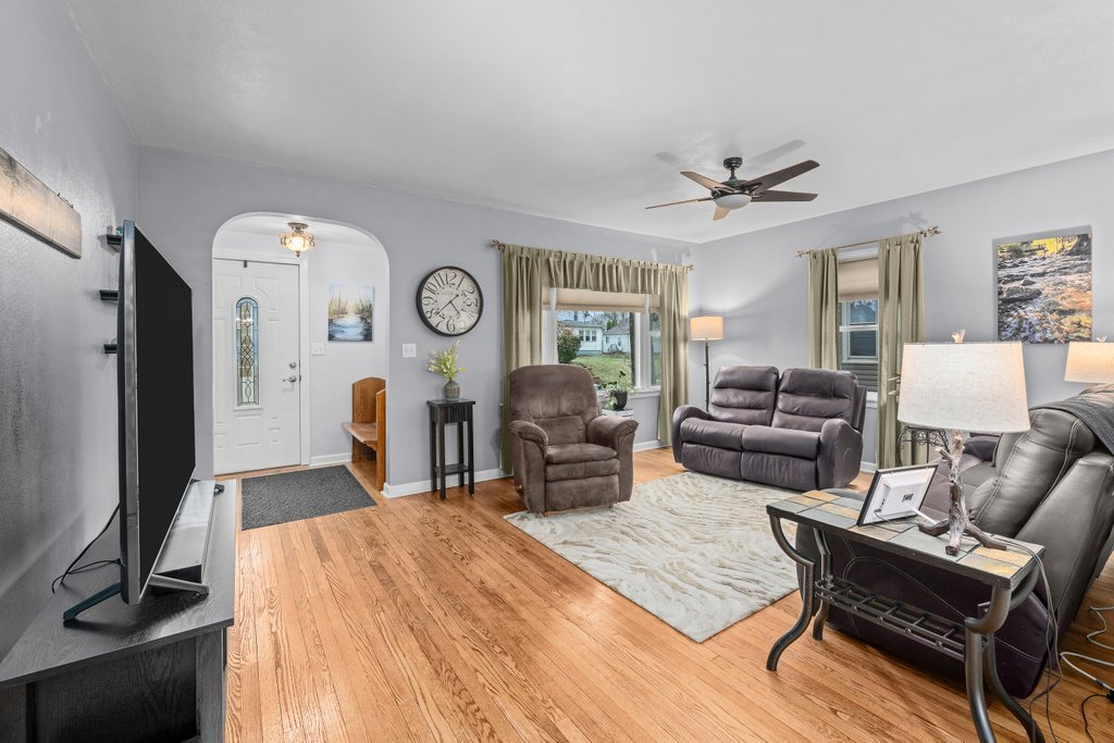 925 12th Avenue Moline, IL 61265 - Photo 3 of 36 a living room with furniture a large window and gym equipment