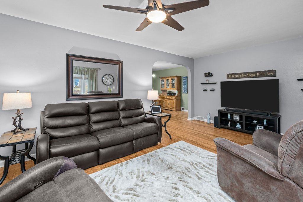 925 12th Avenue Moline, IL 61265 - Photo 5 of 36 a living room with furniture and a flat screen tv