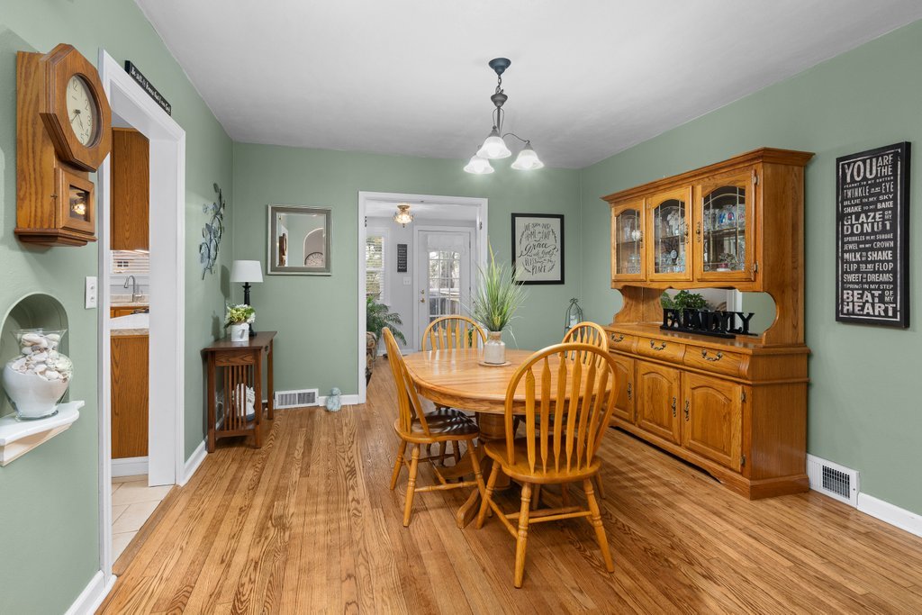 925 12th Avenue Moline, IL 61265 - Photo 7 of 36 a view of a dining room with furniture window and wooden floor
