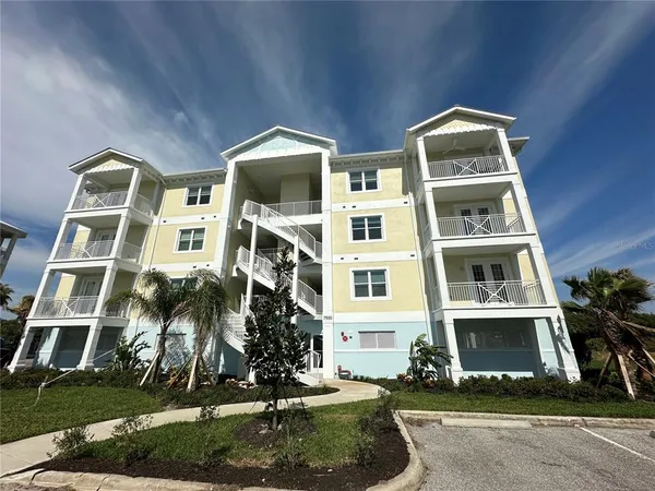 front view of building with a yard