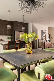 a room with stainless steel appliances kitchen island granite countertop furniture