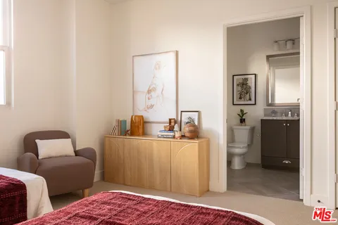 a living room with furniture and a lamp