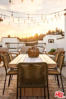 a dining room with a table and chairs
