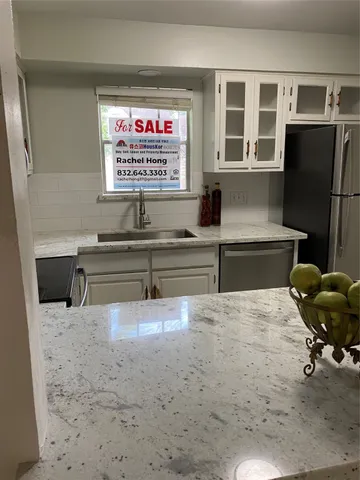 a bathroom with a shower and toilet