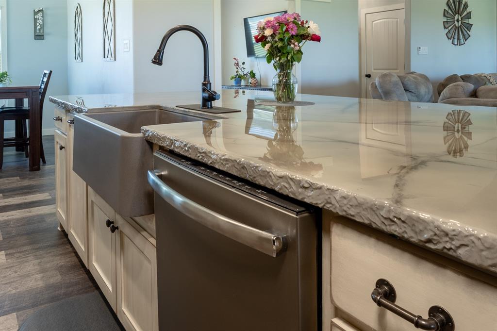 14910 Old Stoney Road Ponder, TX 76259 - Photo 8 of 36 a kitchen with granite countertop a sink and a granite counter tops