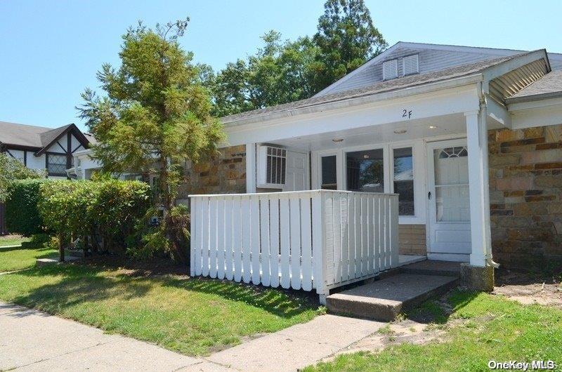 2 F Independence Court, Unit 2F Ridge, NY 11961 - Photo 1 of 1 a view of a house with a yard