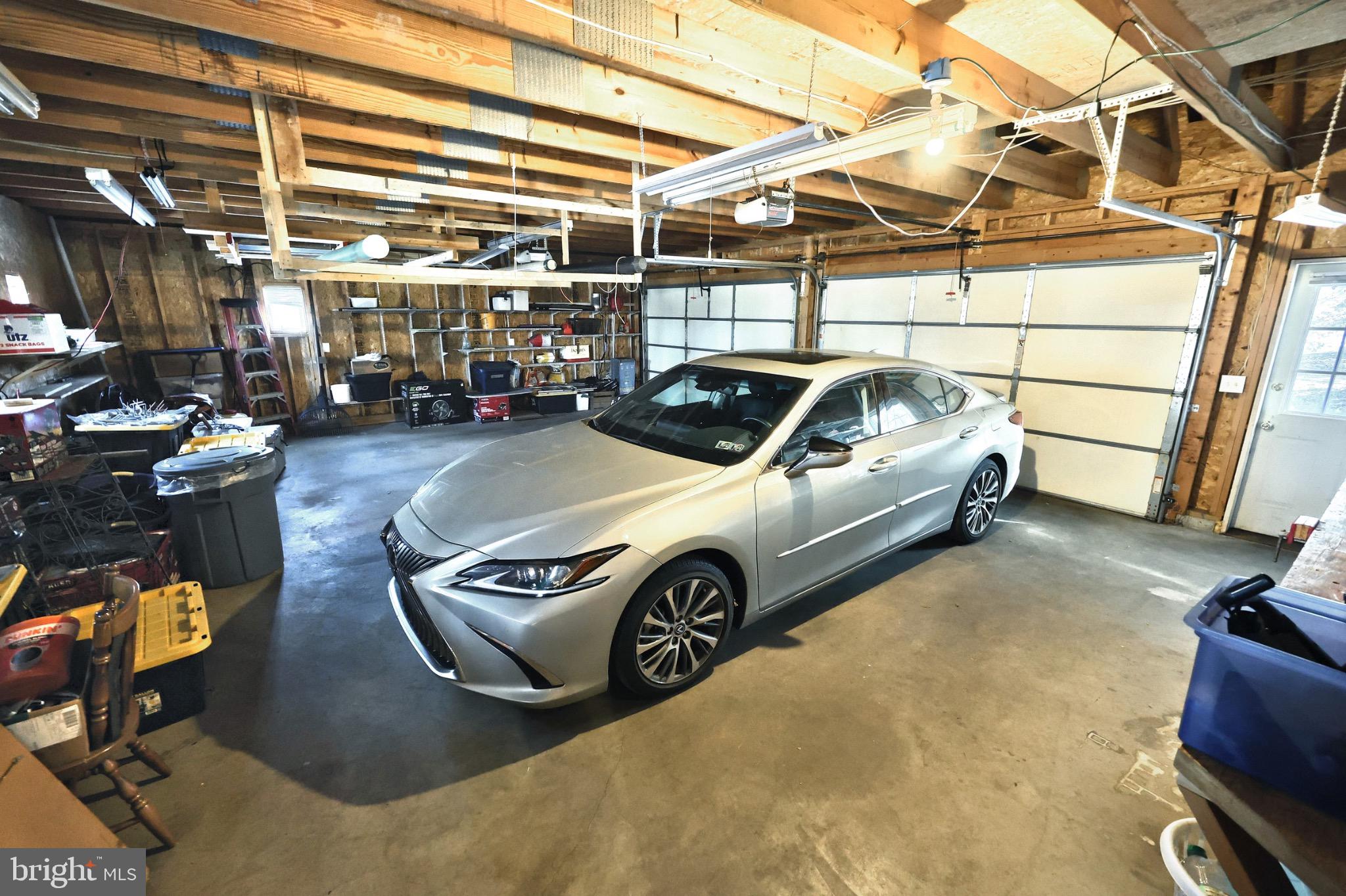 4205 Grandview Road Hanover, PA 17331 - Photo 60 of 70 Spacious garage with a sleek silver sedan.