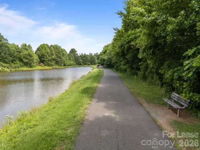 a view of a lake with a yard