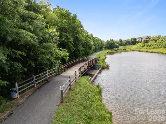 a view of a lake with a city from a bench