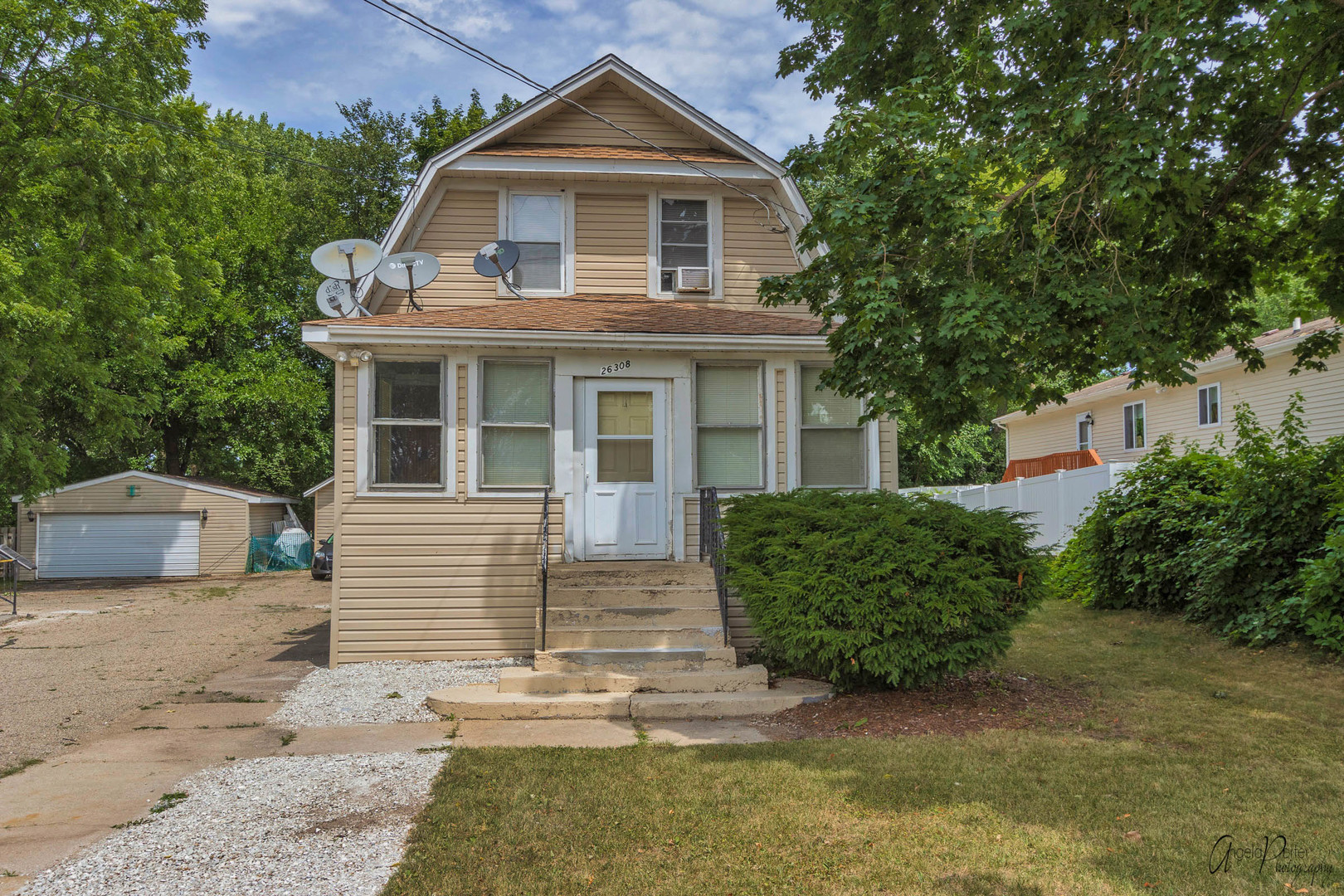 26308 West Rollins Road Ingleside, IL 60041 - Photo 1 of 26 a front view of a house with a garden