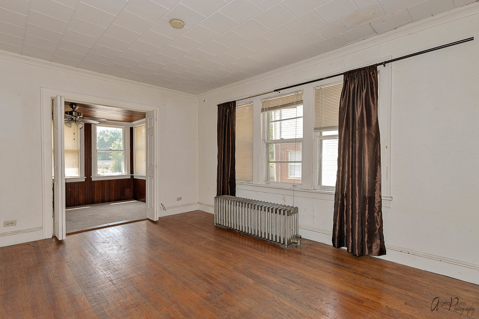 26308 West Rollins Road Ingleside, IL 60041 - Photo 6 of 26 an empty room with wooden floor and windows