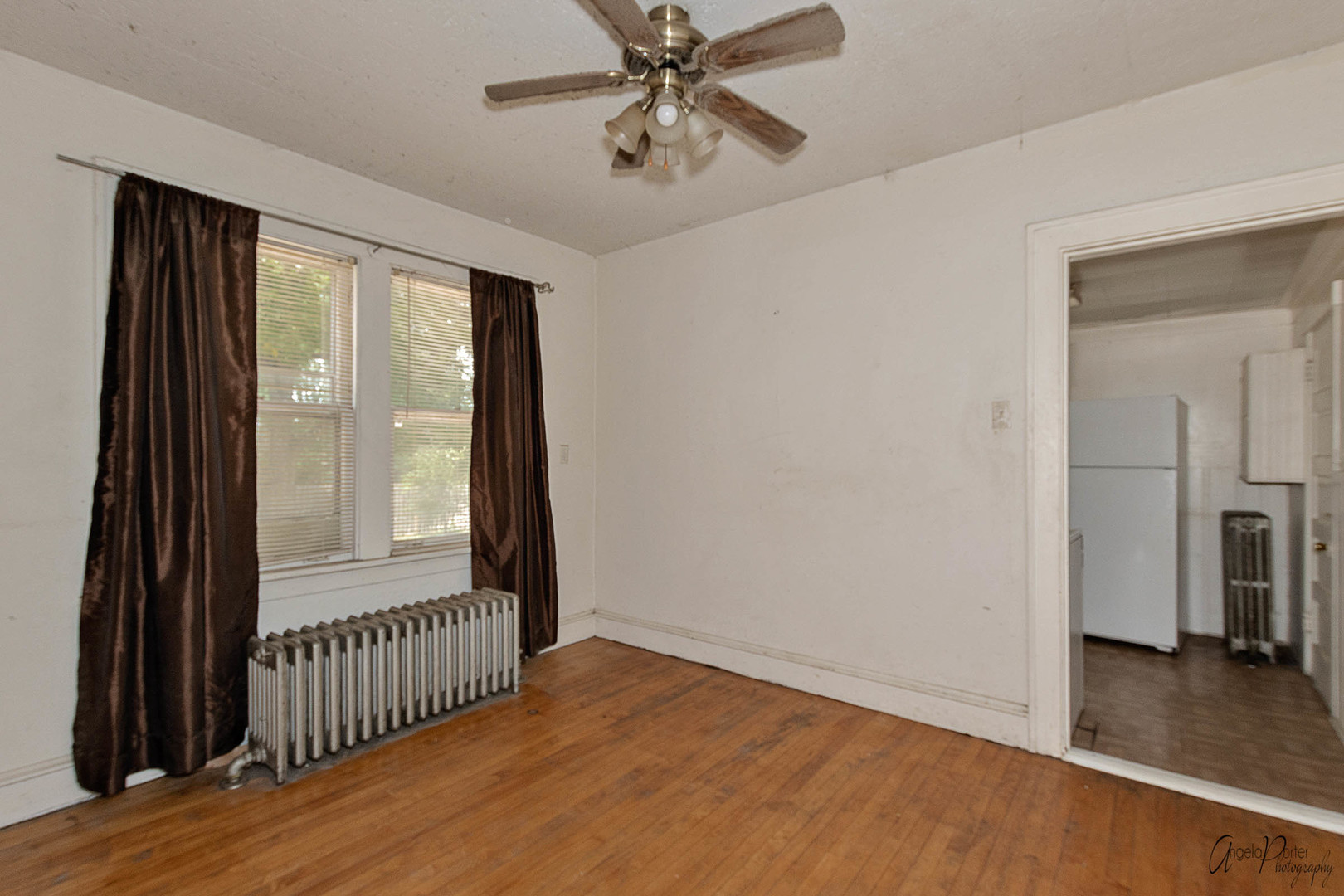 26308 West Rollins Road Ingleside, IL 60041 - Photo 9 of 26 a view of a room with wooden floor fan and windows
