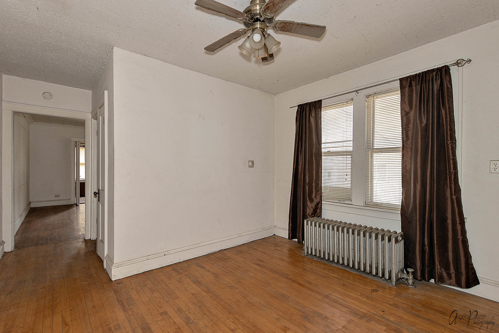 26308 West Rollins Road Ingleside, IL 60041 - Photo 10 of 26 a view of a livingroom with wooden floor and window