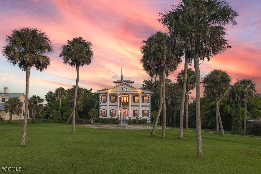a view of a park with a palm trees