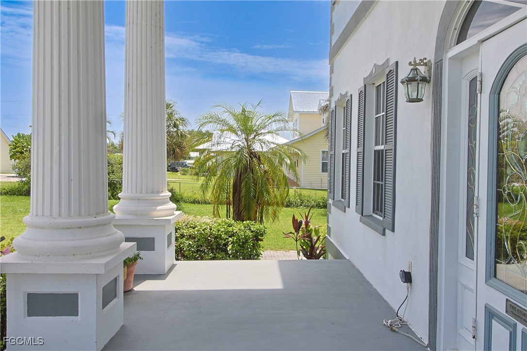 21810 Pearl Street Alva, FL 33920 - Photo 13 of 50 a view of a potted plants in front of door