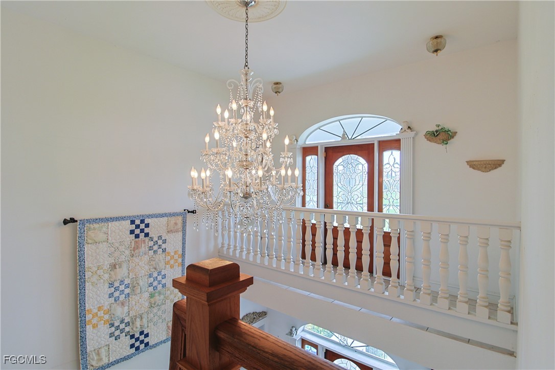 21810 Pearl Street Alva, FL 33920 - Photo 15 of 50 a view of a hallway with windows and chandelier