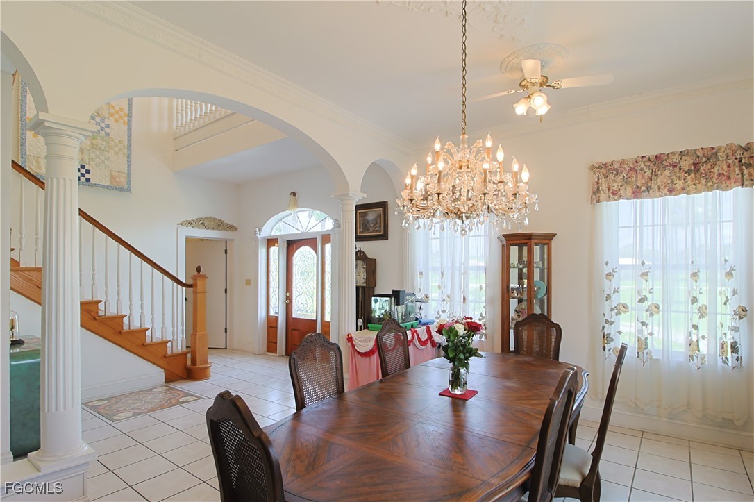 21810 Pearl Street Alva, FL 33920 - Photo 17 of 50 a view of a dining room with furniture and a chandelier