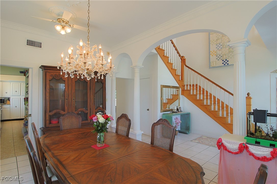 21810 Pearl Street Alva, FL 33920 - Photo 18 of 50 a view of a dining room with furniture and chandelier