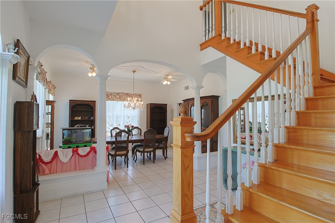 21810 Pearl Street Alva, FL 33920 - Photo 19 of 50 a view of dining area with chandelier and fireplace