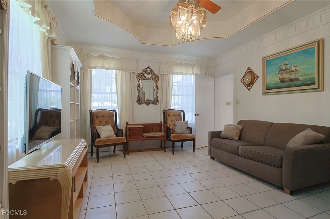 21810 Pearl Street Alva, FL 33920 - Photo 21 of 50 a living room with furniture and a flat screen tv