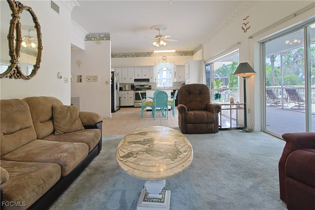 21810 Pearl Street Alva, FL 33920 - Photo 25 of 50 a living room with furniture and a chandelier