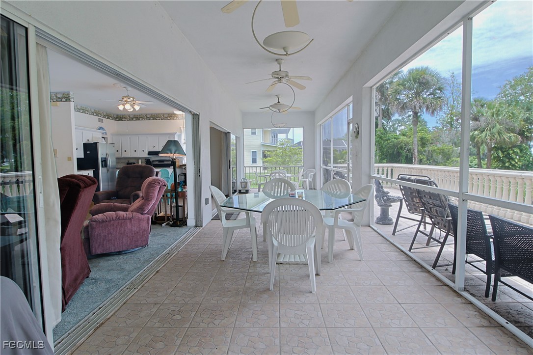 21810 Pearl Street Alva, FL 33920 - Photo 30 of 50 a view of a dining room with furniture window and outside view