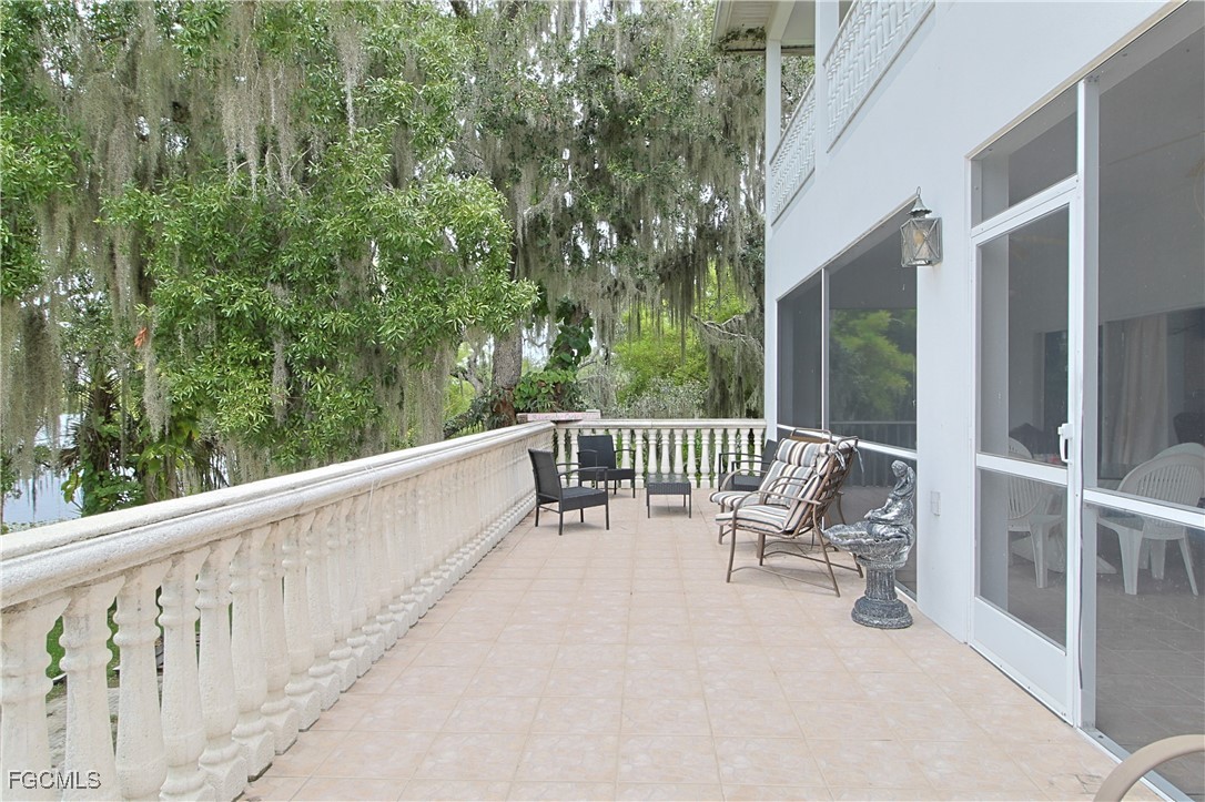 21810 Pearl Street Alva, FL 33920 - Photo 31 of 50 a balcony with chairs