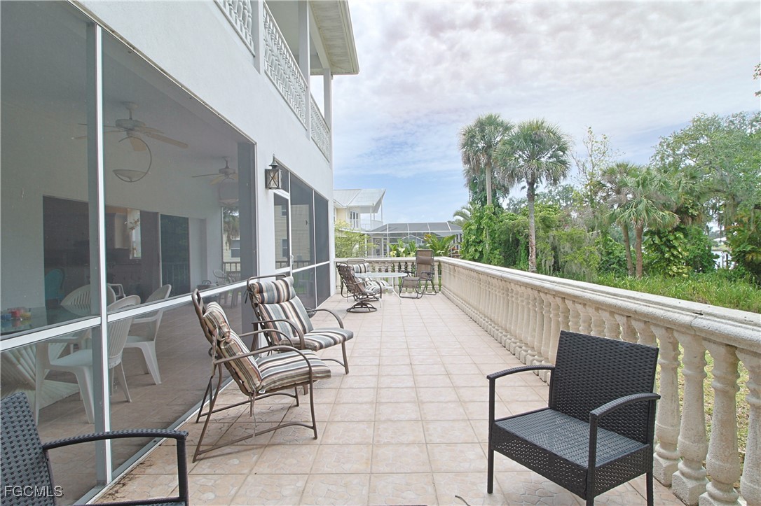21810 Pearl Street Alva, FL 33920 - Photo 32 of 50 a view of balcony with furniture