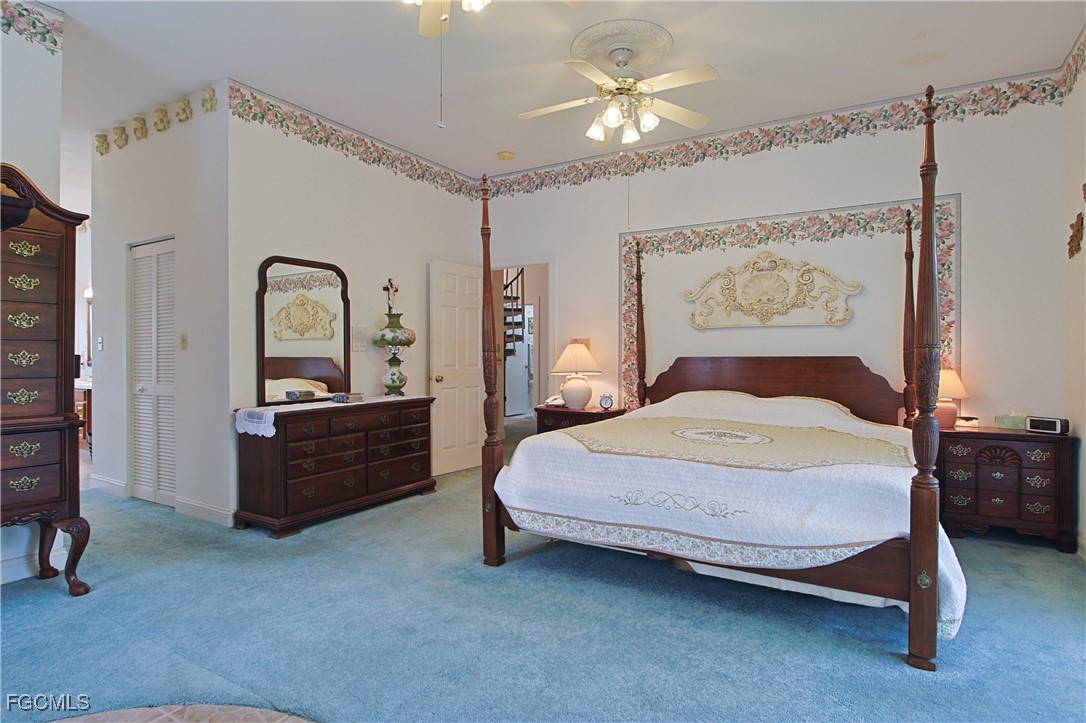 21810 Pearl Street Alva, FL 33920 - Photo 34 of 50 a bedroom with a bed and a dresser