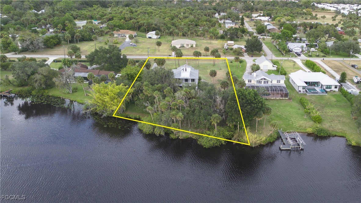 21810 Pearl Street Alva, FL 33920 - Photo 4 of 50 an aerial view of residential houses with outdoor space and parking