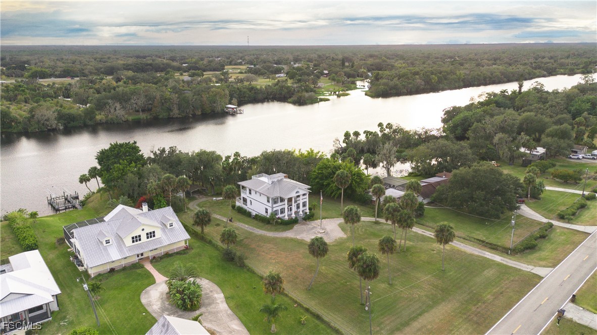 21810 Pearl Street Alva, FL 33920 - Photo 5 of 50 a view of a lake in middle of the town