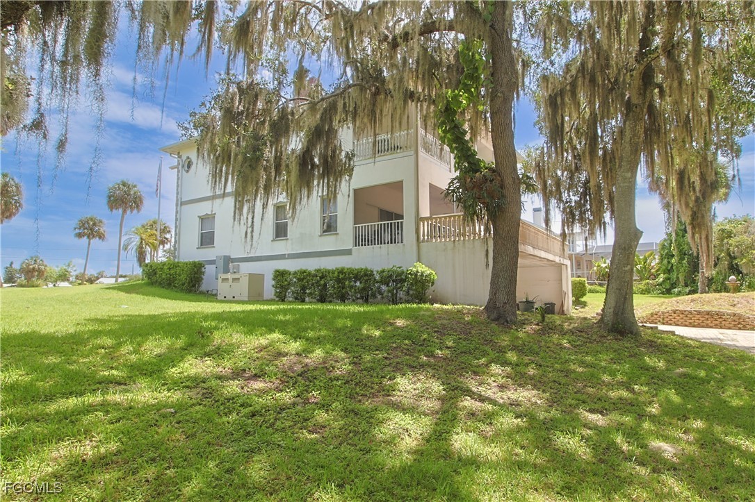 21810 Pearl Street Alva, FL 33920 - Photo 8 of 50 a view of a house with a yard
