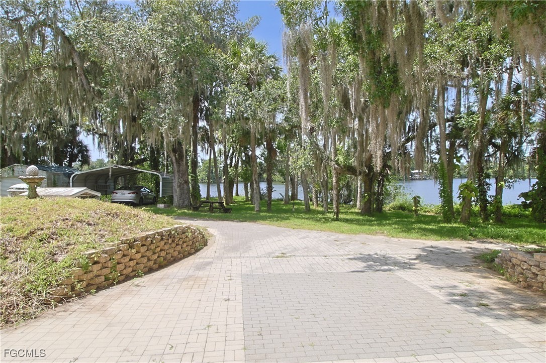 21810 Pearl Street Alva, FL 33920 - Photo 9 of 50 a view of a road with a house in the background