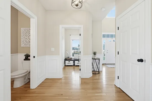 a view of a dining room with furniture and wooden floor