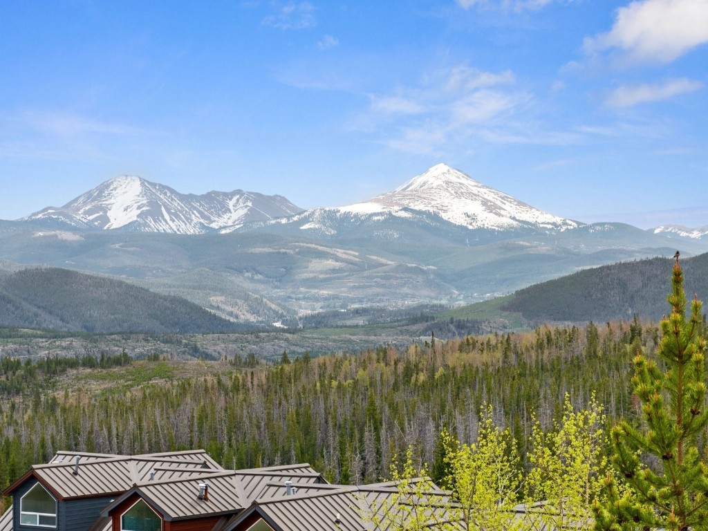 9825 Ryan Gulch Road, Unit B108 Silverthorne, CO 80498 - Photo 17 of 26 a view of a lake with a mountain in the background