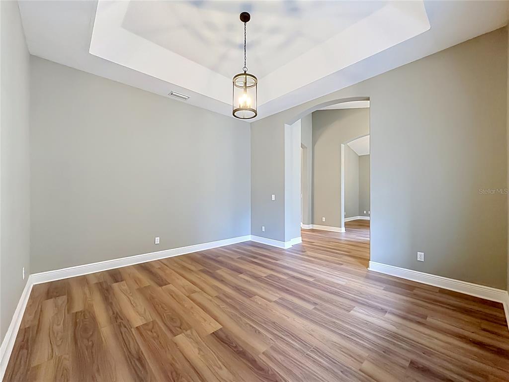 28549 Shirley Shores Road Tavares, FL 32778 - Photo 15 of 65 a view of room with wooden floor fan and window