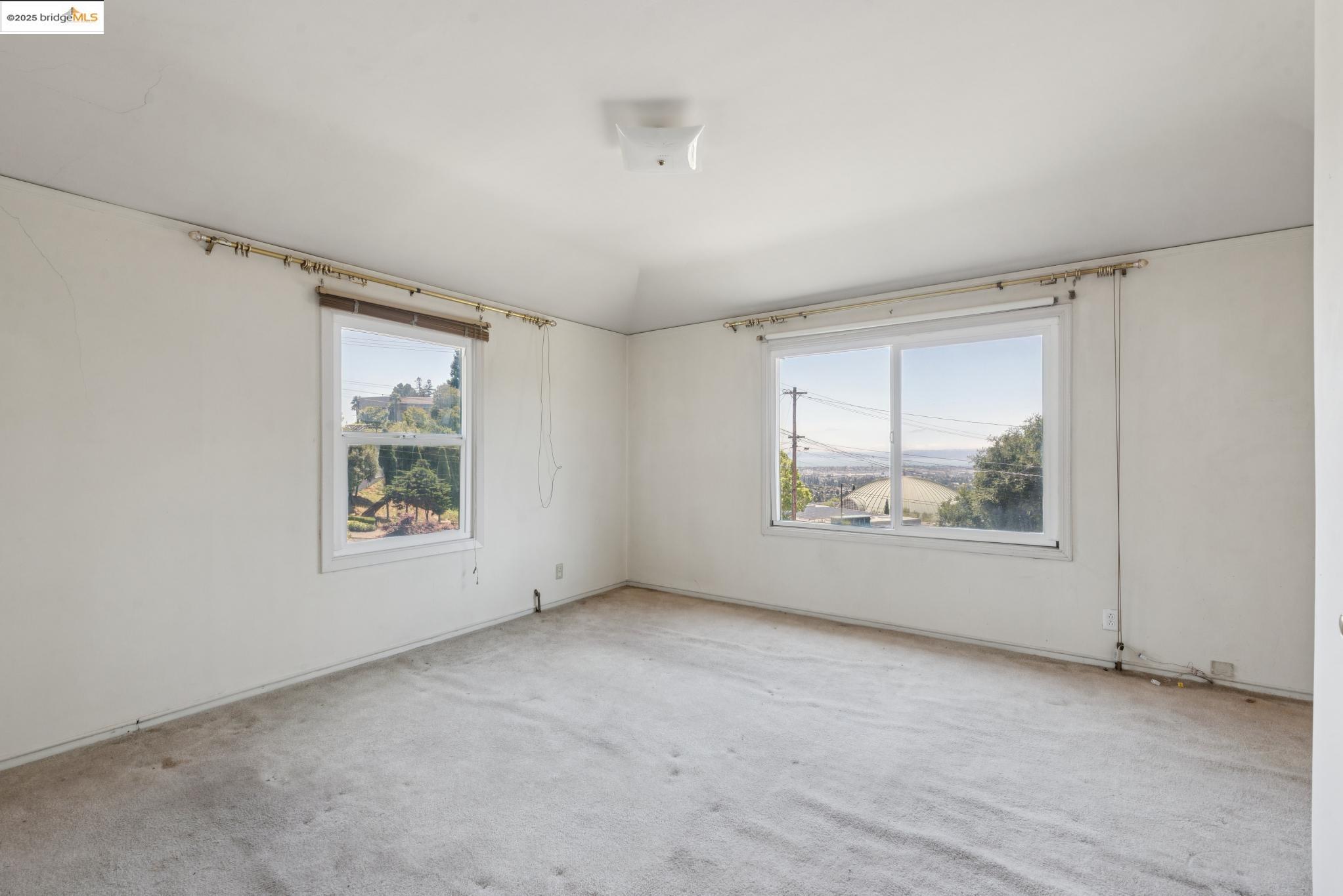 4751 Lincoln Avenue Oakland, CA 94602 - Photo 27 of 60 Spare room featuring healthy amount of natural light and carpet floors