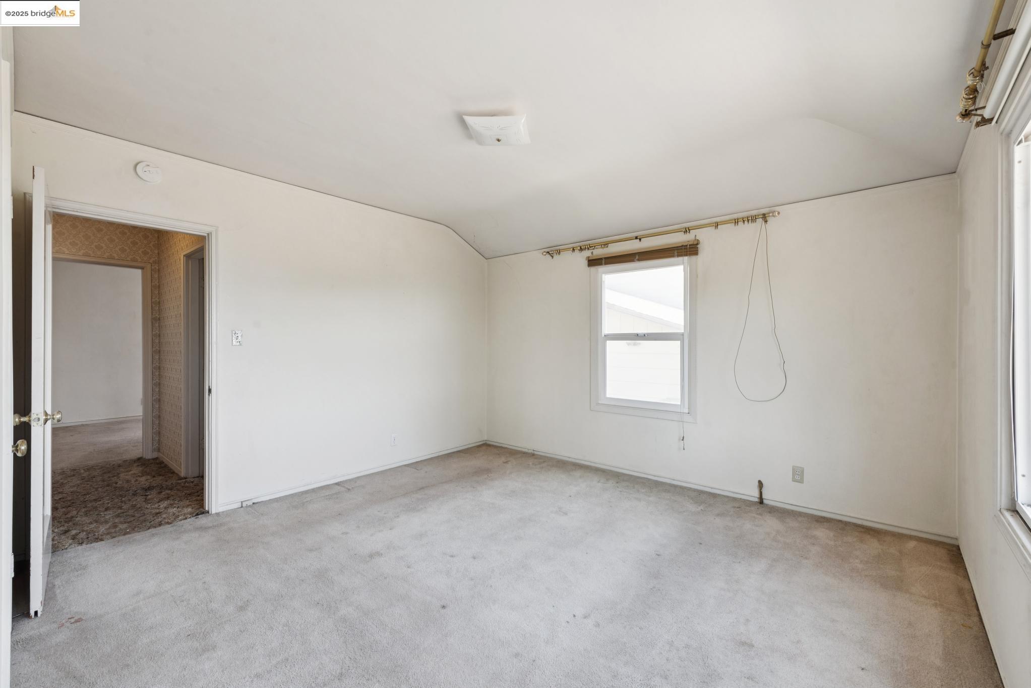 4751 Lincoln Avenue Oakland, CA 94602 - Photo 32 of 60 Unfurnished bedroom featuring carpet flooring and vaulted ceiling