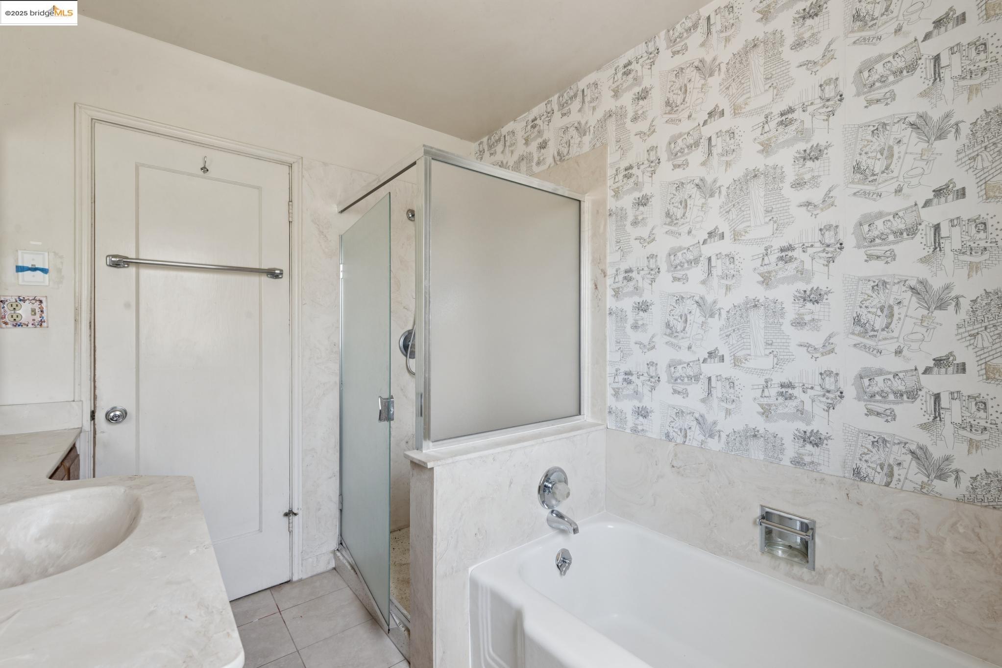 4751 Lincoln Avenue Oakland, CA 94602 - Photo 37 of 60 Full bathroom featuring wallpapered walls, a garden tub, a stall shower, vanity, and light tile patterned flooring